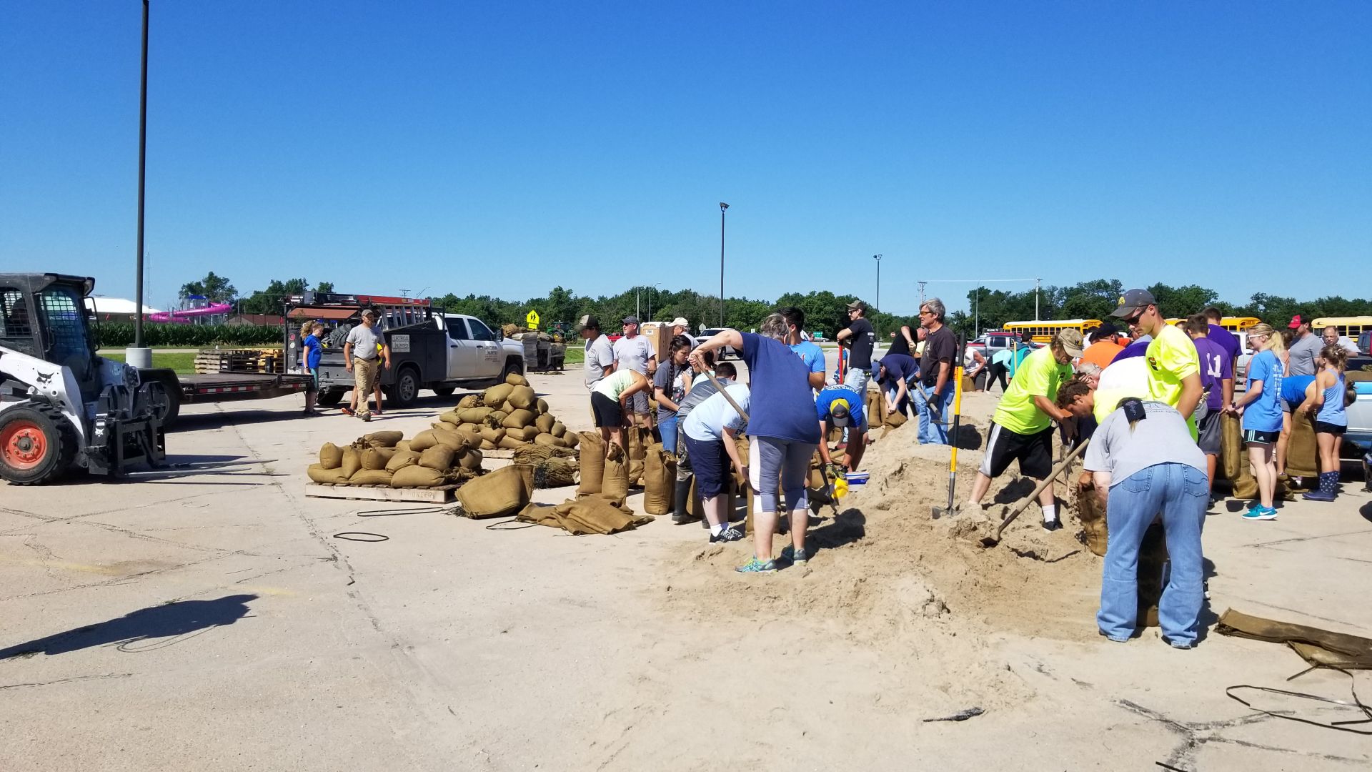 Volunteers fill sandbags in Wood River